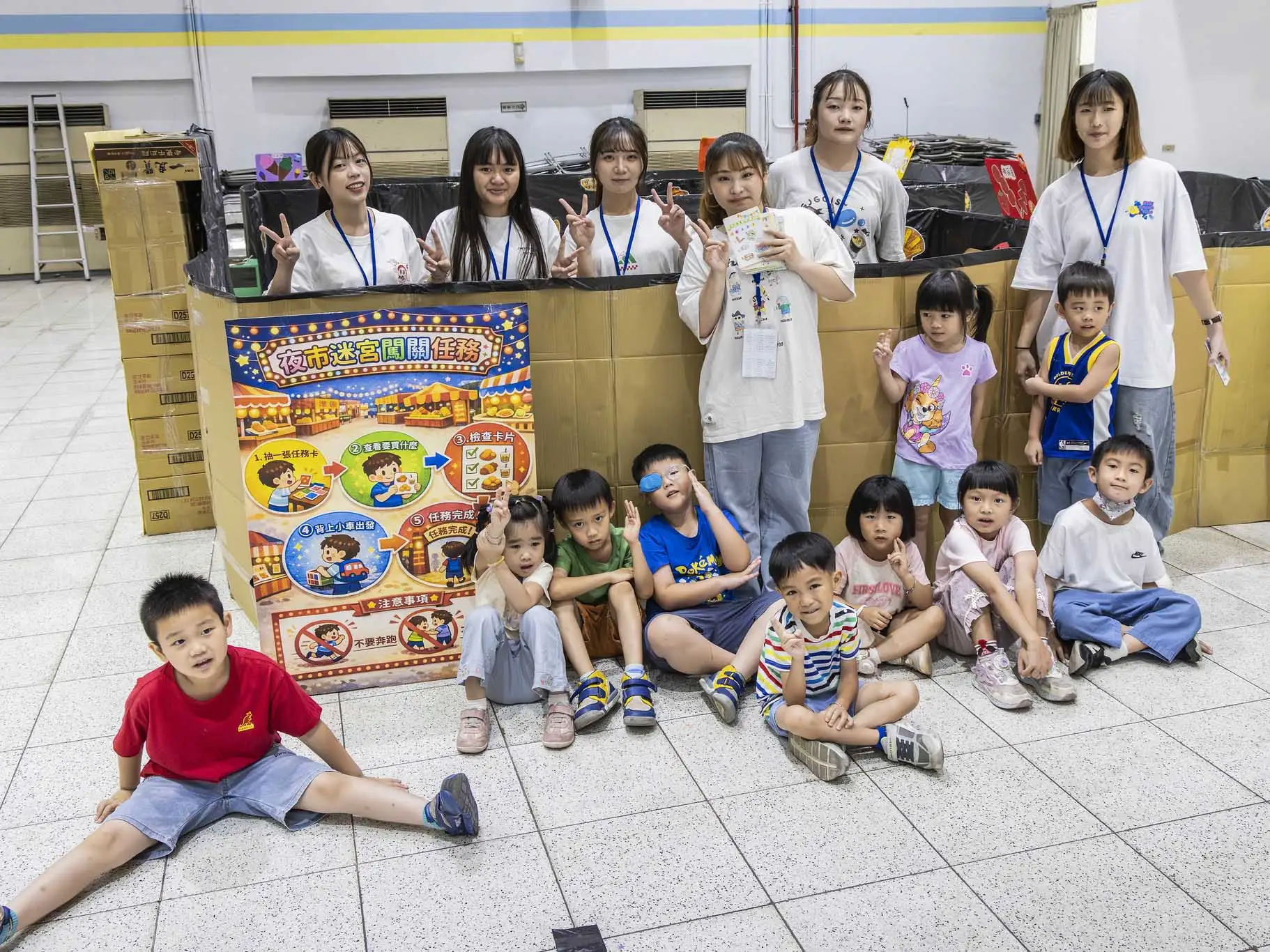 嘉南藥理大學幼保系畢業生以台灣夜市文化為主題，設計沉浸式闖關活動，透過遊戲互動提升幼兒學習與社交能力。(圖/嘉南藥理大學幼保系提供)
